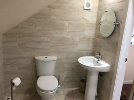 A bathroom with a toilet and sink at Country Retreat Sleeps 2 Holyhead