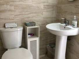 A bathroom with a toilet and sink at Country Retreat Sleeps 2 in Holyhead