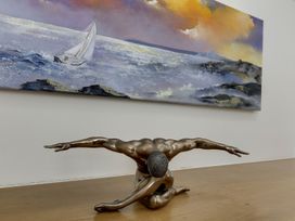 A sculpture and painting in a gallery at Poppyfields Stable Redruth