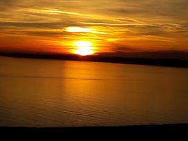 A sunset over the water