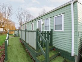 A mobile home with stairs and a pathway at No 35 MP Billing Aquadrome Holiday Park in 