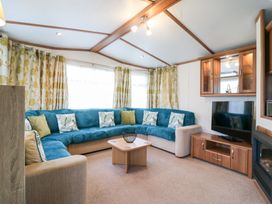 A living room with a sofa and coffee table at No 35 MP Billing Aquadrome Holiday Park