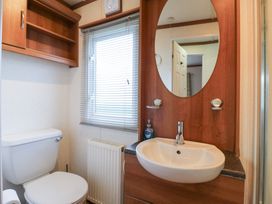 A bathroom with a sink and toilet at No 35 MP Billing Aquadrome Holiday Park