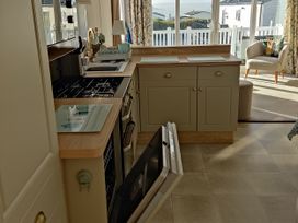 A kitchen with an oven and sink at Harbour View in Poole