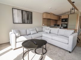A living room with a sofa and coffee table at No.6 - The Pines, Delamere