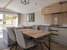 A dining room with a table and chairs at No.6 - The Pines, Delamere