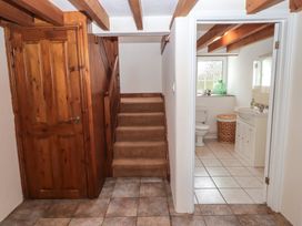 An entrance area with stairs and bathroom features at Rhosgranog Cottage Llandeloy near Solva