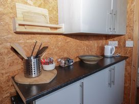A kitchen with utensils and appliances at Rhosgranog Shepherds Hut Llandeloy near Solva
