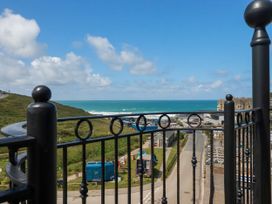 A view of the ocean and landscape from a balcony at Lowenna Watergate Bay near Newquay