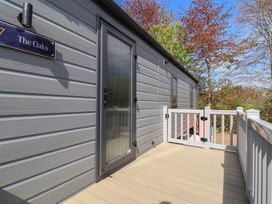 An outdoor area with a door and railing at No.20 - The Oaks in Delamere