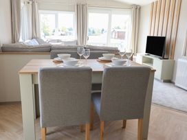 A dining area with a table and chairs at No.20 - The Oaks Delamere