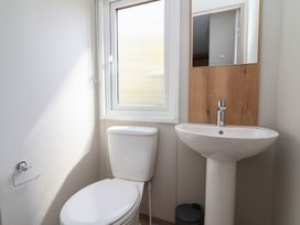 A bathroom with a sink and toilet at No.20 - The Oaks in Delamere