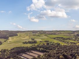 An outdoor view of fields and trees at The Oaks 3 Bedrooms in Delamere