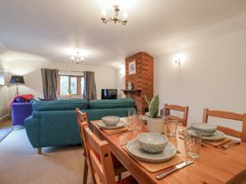 A dining area with a table and chairs at The Pantiles in Banham