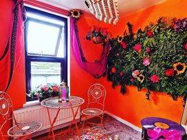 A sitting area with chairs and a table at Frida's Cottage in Whitby