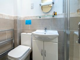 A bathroom with a sink and toilet at Bank House Cottage in Lancaster