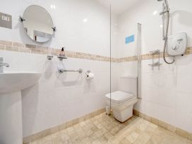 A bathroom with shower and toilet at Bank House Cottage in Glasson Dock