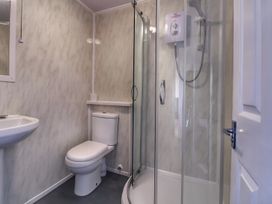 A bathroom with a shower and toilet at Sea View Retreat in Bridlington