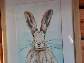 A framed drawing of a rabbit at The Posh Bothy 2 in Roy Bridge