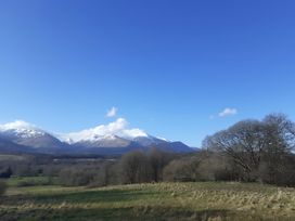 A landscape featuring mountains and trees at The Posh Bothy 2 in Roy Bridge