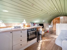 A kitchen with appliances and a countertop at Cosy Escape in Minster On Sea