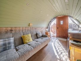 A living room with a door and sofa at Cosy Escape in Minster On Sea