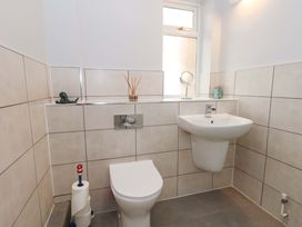 A bathroom featuring a sink and toilet at 15 Coombe Avenue