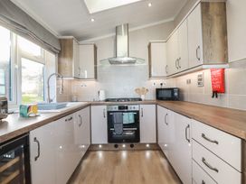 A kitchen with appliances and utensils at Moorland View