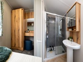 A bathroom with a shower and sink at Ashberry 38 x 12 Two Bed - 5 Northwich