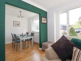 A dining room with a table and chairs at Wansfell View in Ambleside
