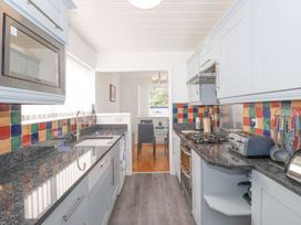 A kitchen with a countertop and dining area at Wansfell View in Ambleside