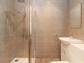 A bathroom with a shower and sink at Wansfell View in Ambleside
