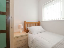 A bedroom with a single bed and a nightstand at Wansfell View in Ambleside