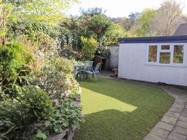 A garden with table and chairs at Wansfell View in Ambleside