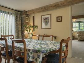 A dining room with a table and chairs at Pillars in Barnstaple