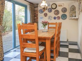 A dining room with a table and chairs at Pillars in Barnstaple