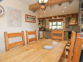 A dining room with a table and chairs at Pillars in Barnstaple