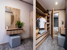A dressing room with a vanity and storage at No 8 Sandstone Lodge Sanctuary Northwich