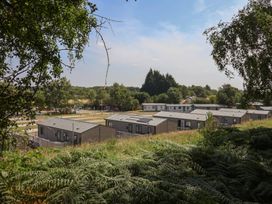 A view of caravans on a hillside at Cedar Lodge 3 Bedrooms in Delamere