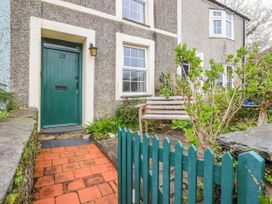 A front door and garden area at 12 Glyn Terrace in Borth-Y-Gest