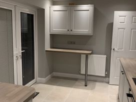 A kitchen with cabinets and a worktop at 43 Goose Green Road in King's Lynn