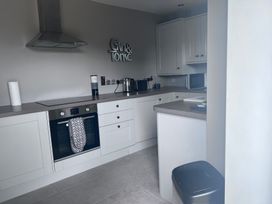 A kitchen with an oven and cabinets at 43 Goose Green Road in King's Lynn