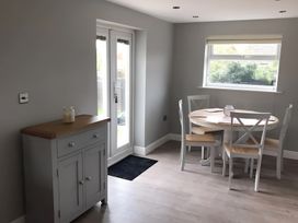 A dining room with a table and chairs at 15 Lamsey Lane in King's Lynn