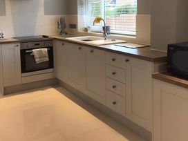 A kitchen with an oven and sink at 15 Lamsey Lane King's Lynn