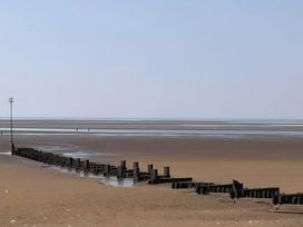 A beach with sea and groynes at 15 Lamsey Lane King's Lynn
