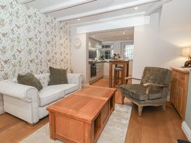A living room with a sofa and a table at No.4 Main Street, Hull
