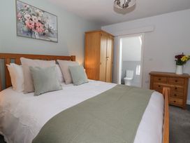 A bedroom with a bed and wardrobe at No.4 Main Street in Hull