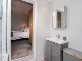 A bathroom featuring a vanity unit and mirror at No.4 Main Street, Hull