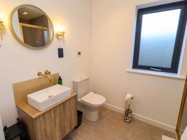 A bathroom with a sink and toilet at 1 Dairy Fields Longframlington