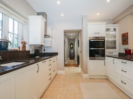 A kitchen with cabinets and an oven at Woodlands house in Ringwood